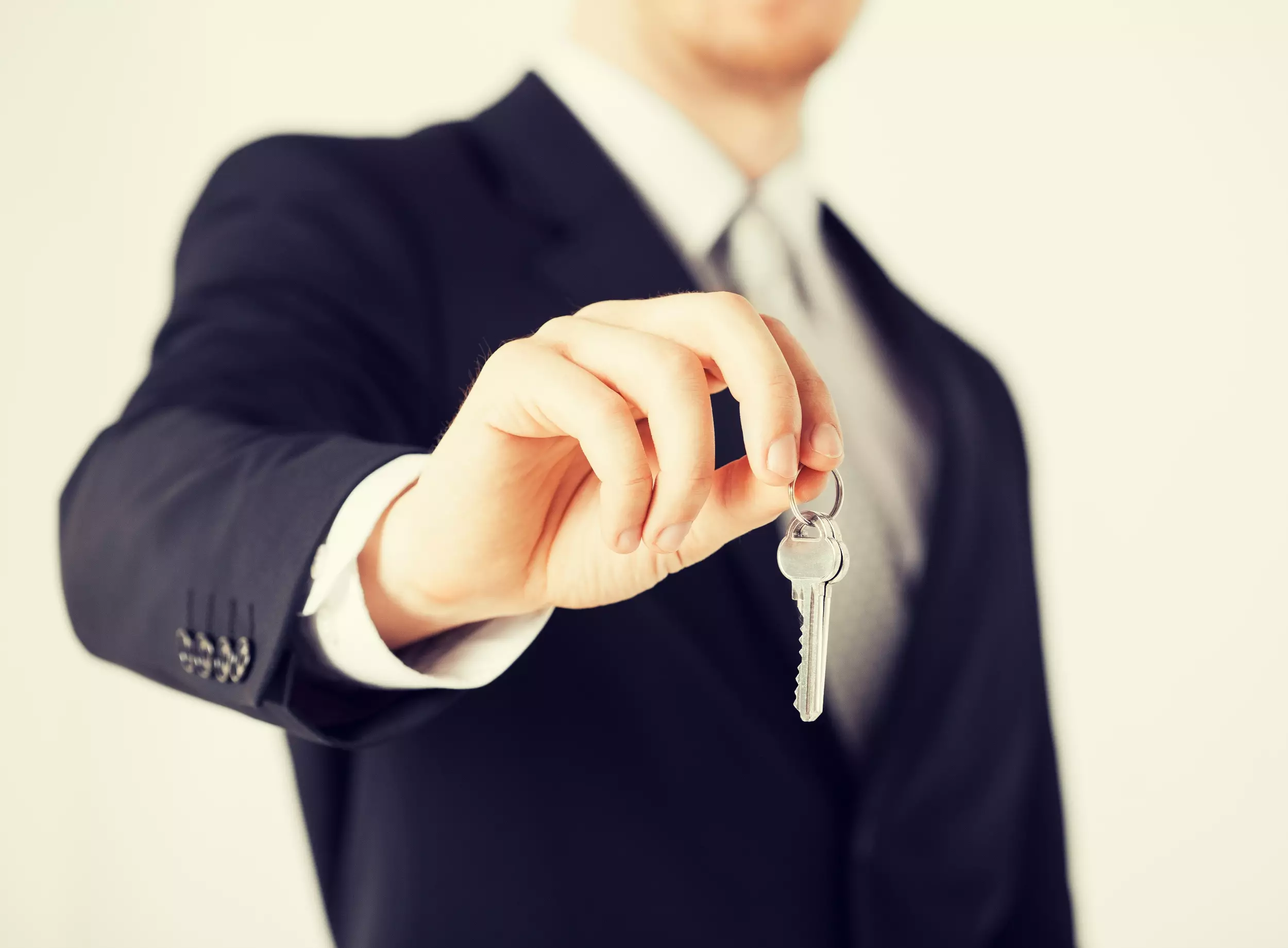 A realtor holding house keys